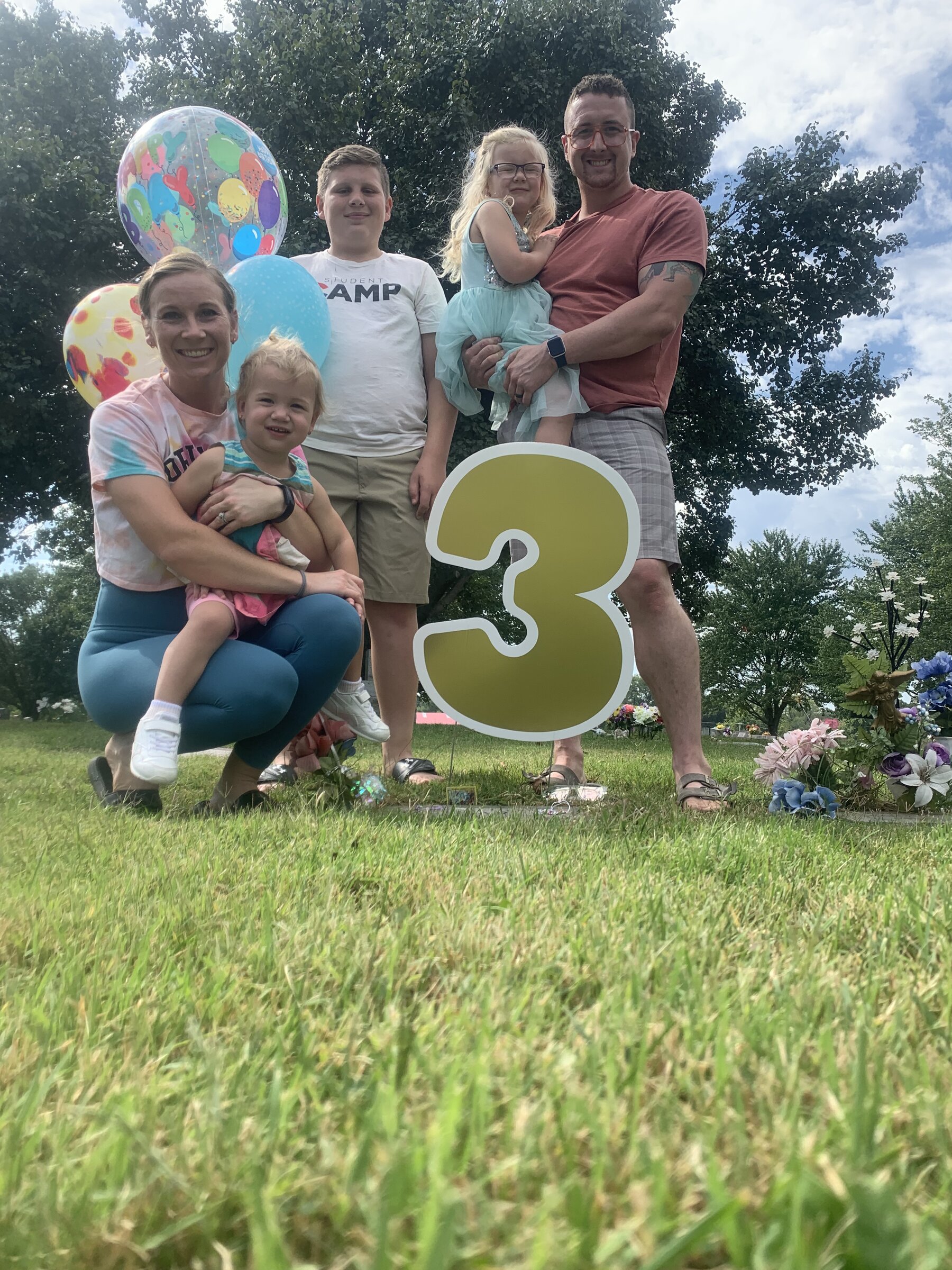 The Reign Enterprises family celebrating at Reign's gravesite — the inspiration behind our company name