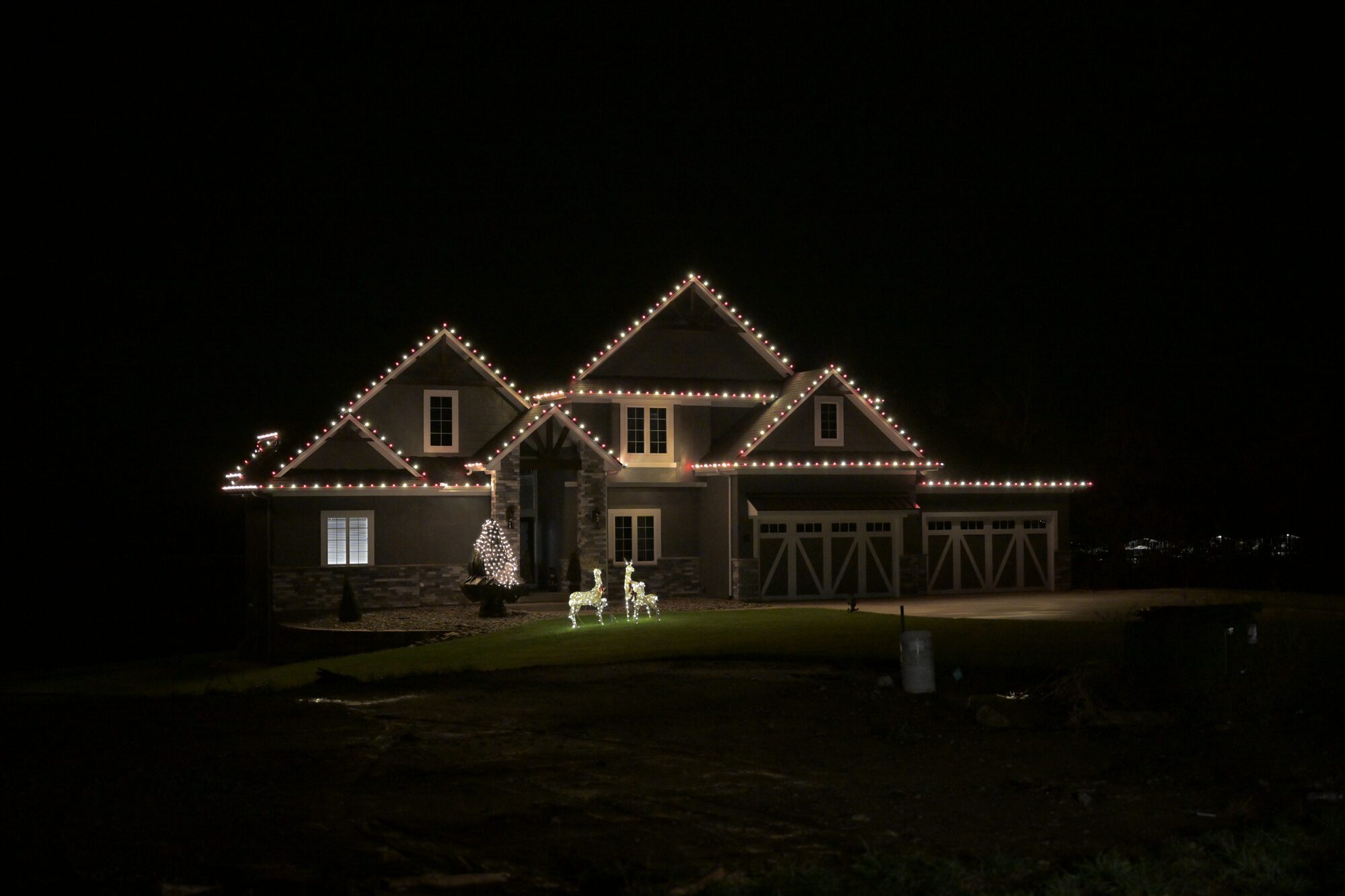 C9 LED roofline installation on large home with tree lights — Reign Enterprises